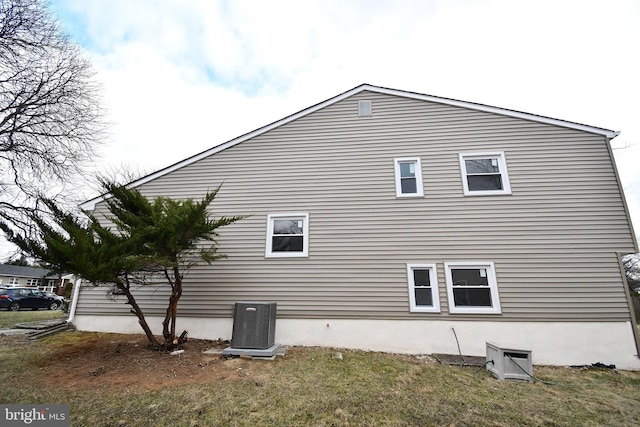 view of side of property with central AC unit