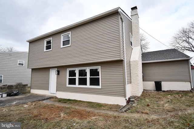 rear view of property featuring a patio area