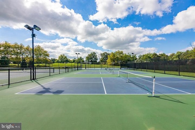 view of sport court with basketball hoop