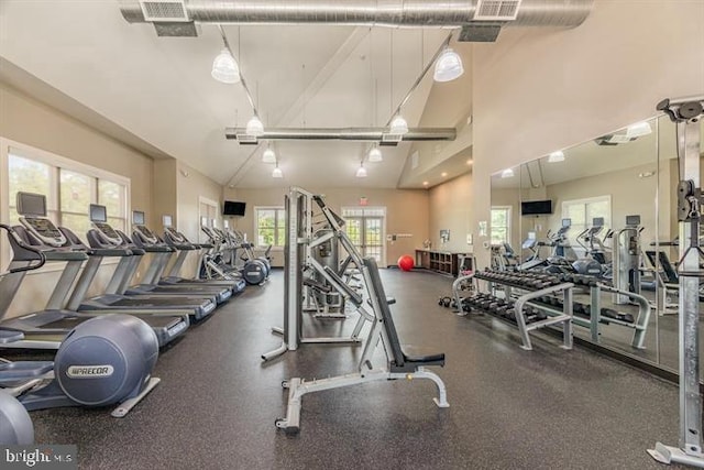 gym with high vaulted ceiling