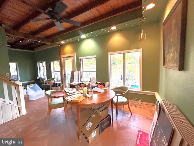 tiled dining area with beamed ceiling, rail lighting, ceiling fan, and wood ceiling