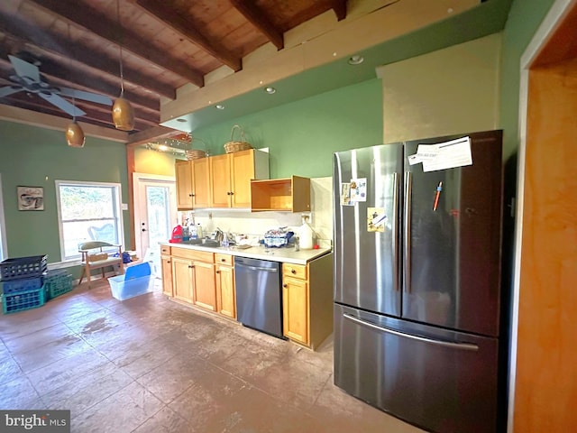 kitchen featuring light brown cabinetry, decorative light fixtures, beamed ceiling, and appliances with stainless steel finishes