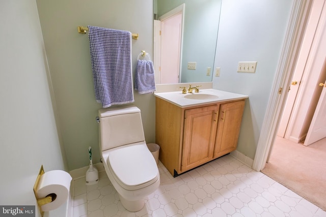 bathroom with vanity and toilet