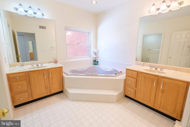 bathroom with vanity and a relaxing tiled tub