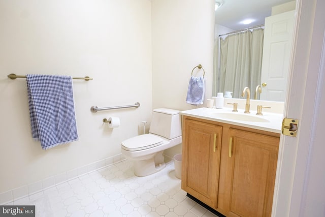 bathroom featuring vanity, toilet, and a shower with shower curtain