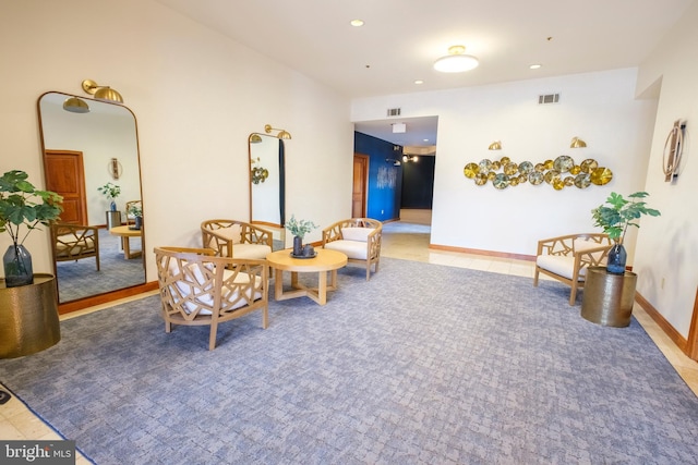 living area with tile patterned flooring