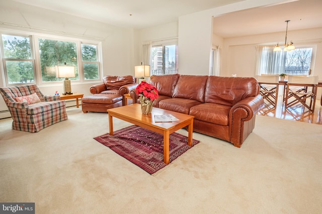 carpeted living room with a baseboard radiator