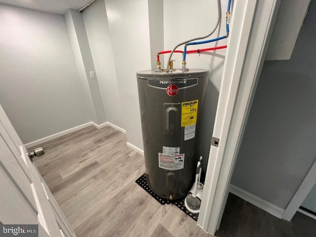 utility room with electric water heater