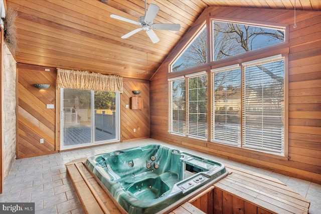 sunroom featuring ceiling fan, wooden ceiling, a jacuzzi, and vaulted ceiling