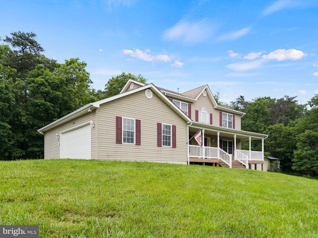 view of front facade featuring covered porch, a front yard, and a garage