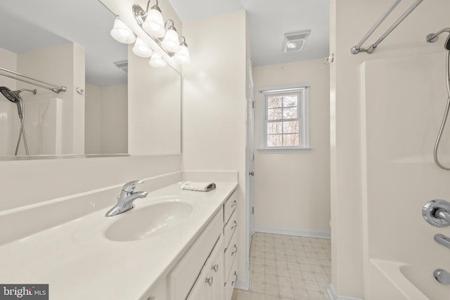 bathroom with washtub / shower combination and vanity