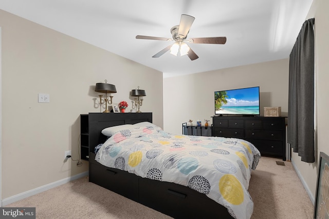 bedroom with light colored carpet and ceiling fan