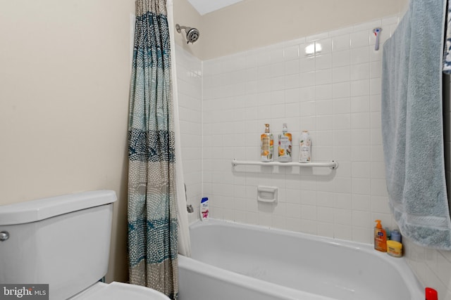 bathroom with toilet and shower / tub combo with curtain