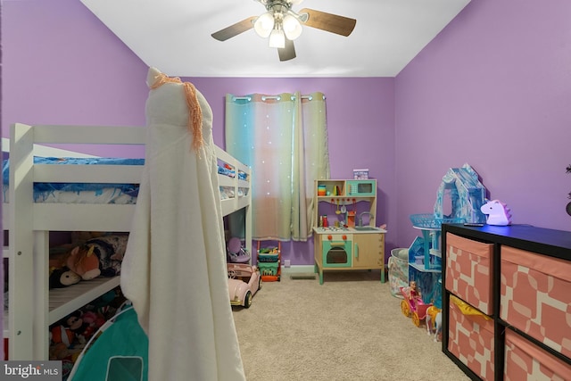 bedroom featuring ceiling fan and light carpet