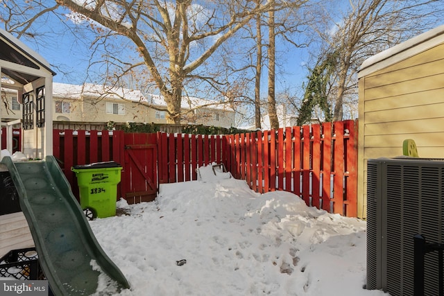 snowy yard with central AC unit