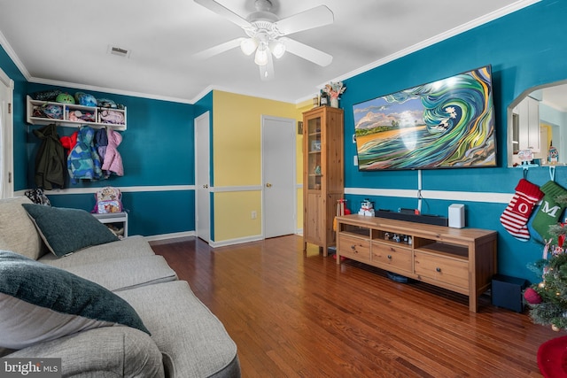 living room featuring hardwood / wood-style flooring, ceiling fan, and ornamental molding