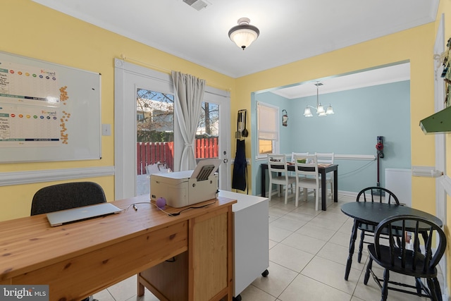 tiled home office featuring a chandelier