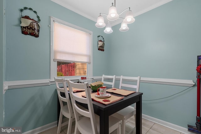 dining room featuring light tile patterned floors and crown molding