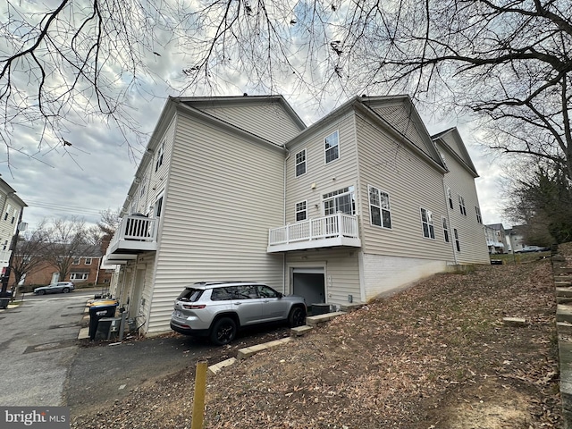 view of home's exterior with a balcony