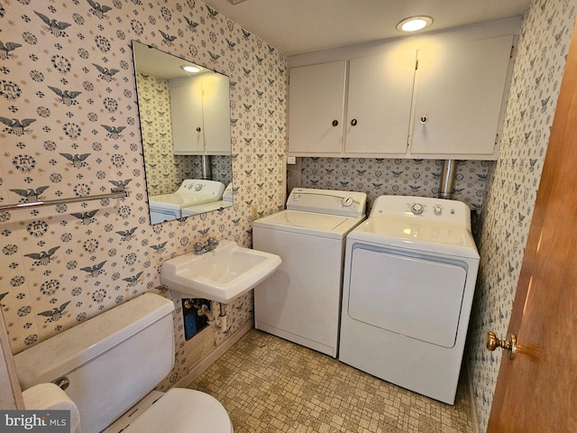 laundry room featuring washer and clothes dryer and sink