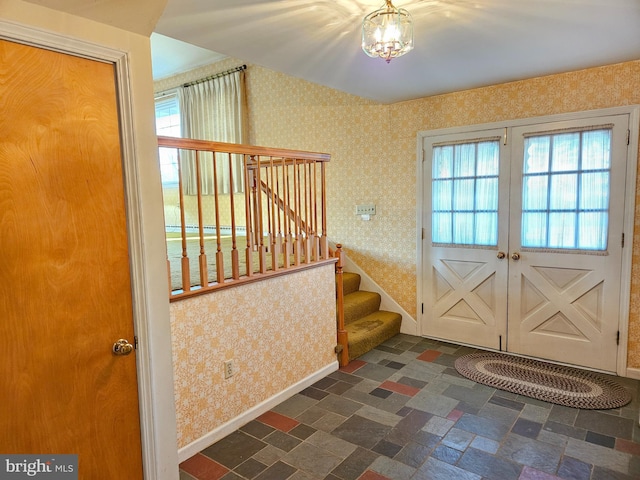 doorway with an inviting chandelier