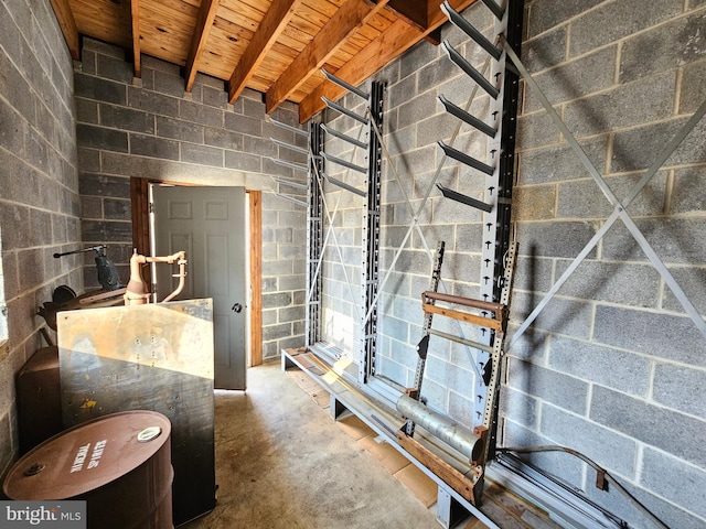 bathroom featuring beam ceiling, wooden ceiling, and concrete floors