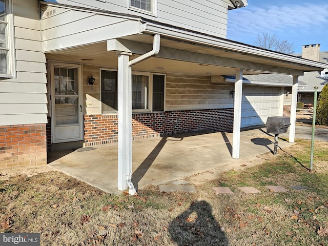 view of patio featuring a garage