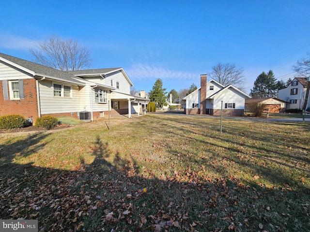 view of yard with central AC unit