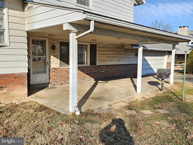 view of patio / terrace with a garage