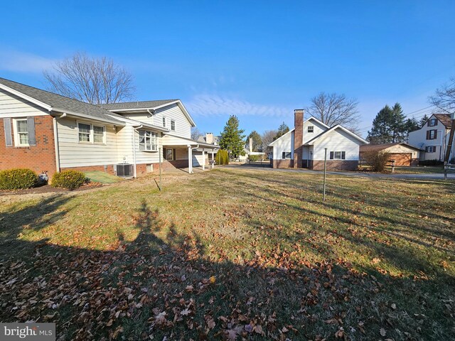 view of yard featuring central AC