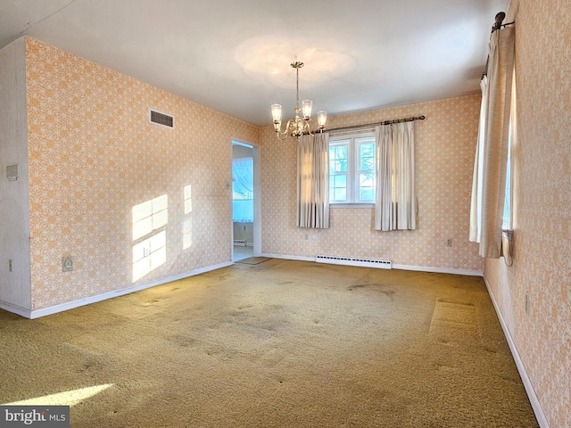 carpeted spare room featuring baseboard heating and an inviting chandelier