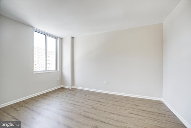 unfurnished room featuring light hardwood / wood-style flooring