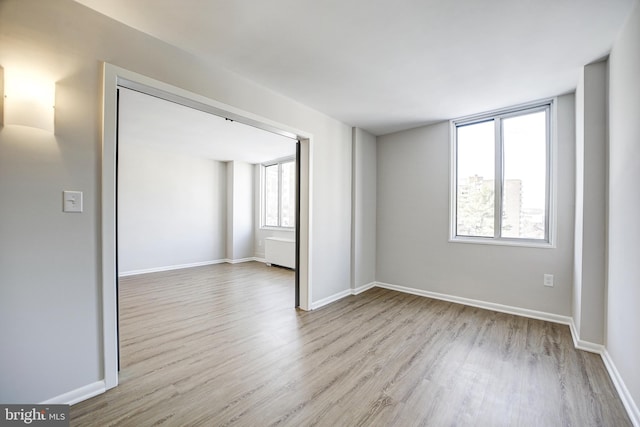 unfurnished room featuring light wood-type flooring