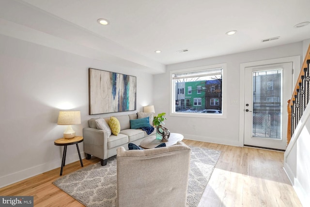 living room with light hardwood / wood-style floors