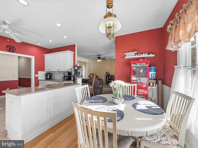 dining space with light wood-style floors, ceiling fan, and recessed lighting