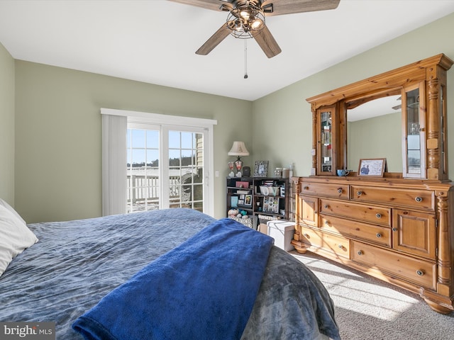 bedroom with access to outside and ceiling fan