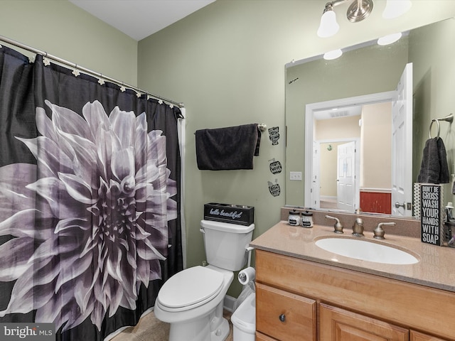 bathroom with toilet, a shower with curtain, visible vents, and vanity