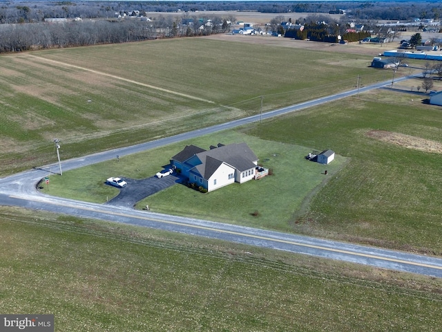 birds eye view of property with a rural view