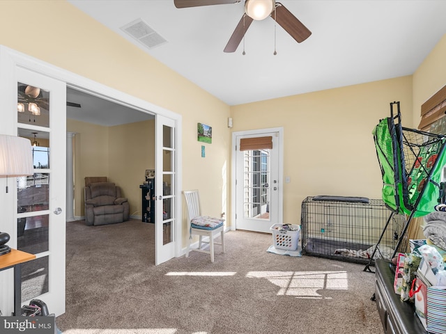 interior space featuring ceiling fan, visible vents, and french doors