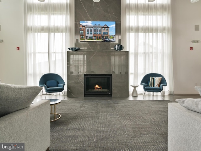 living room featuring a fireplace and a wealth of natural light