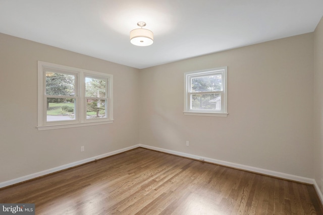 spare room featuring light wood-type flooring