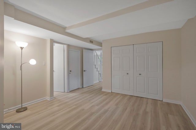 unfurnished bedroom with light wood-type flooring