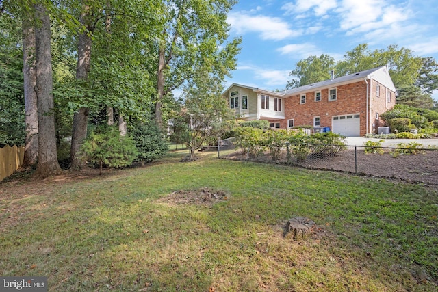 view of yard featuring a garage