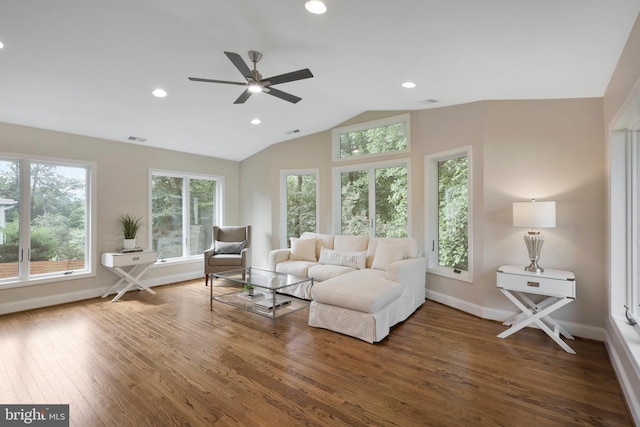 living room featuring dark wood-type flooring, ceiling fan, and lofted ceiling