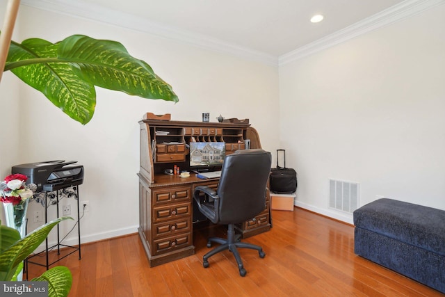 office with wood-type flooring and crown molding