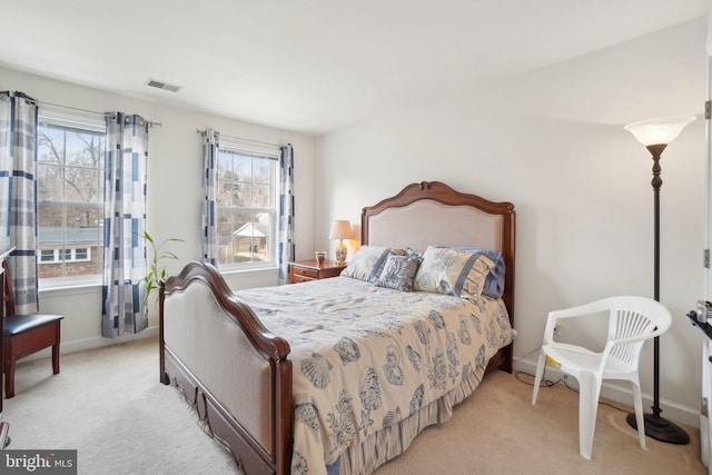 bedroom featuring light colored carpet