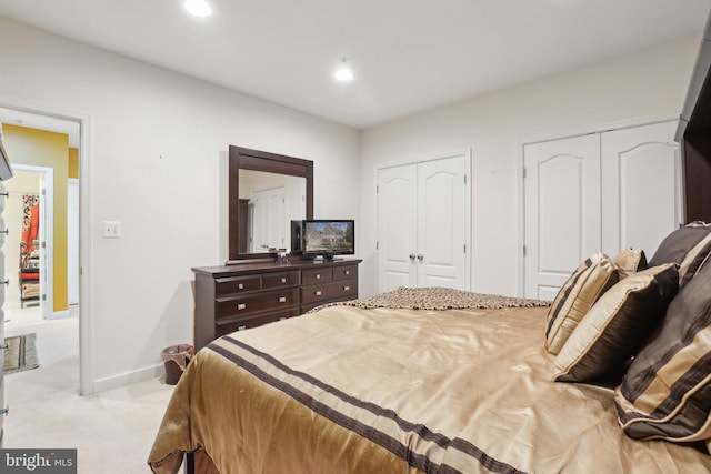 carpeted bedroom with two closets