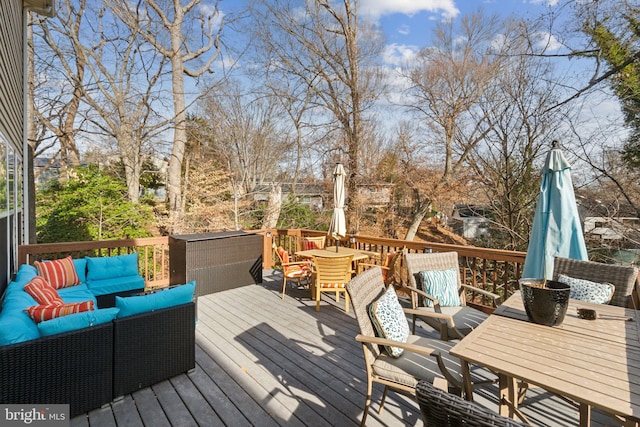 wooden deck featuring an outdoor hangout area