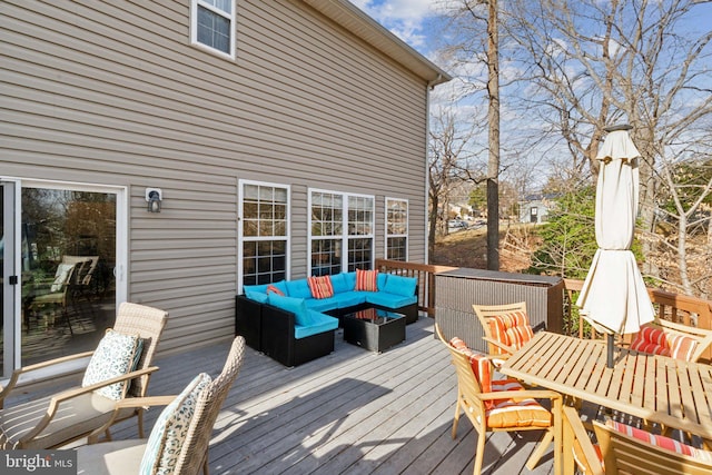 wooden terrace featuring an outdoor living space