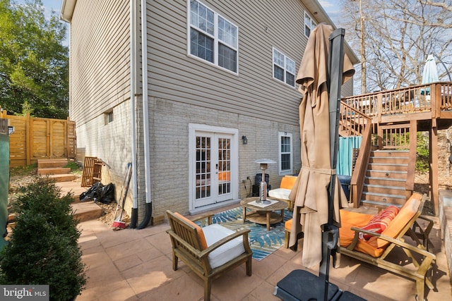 view of patio / terrace with a deck and french doors